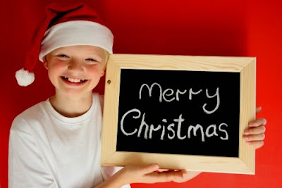 Cute kid showing Merry Christmas slate hot image