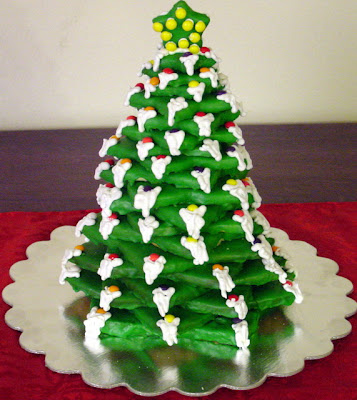Very beautiful big sized green color Christmas cake designed as Christmas tree Christian religious image