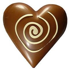 Nice tasty and creamy Chocolate egg re sized into glowing shine heart shaped valentine sexy pic la pascua
