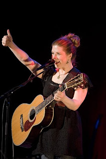 Dar Williams showing Thumbs up in black dress playing guitar or violin on her performance on stage at at Bearsville Theatre, Woodstock, NY sexy gallery