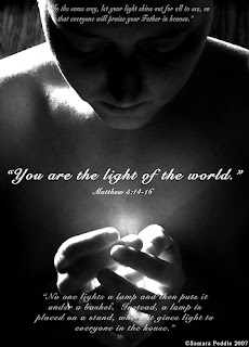 You are the light of the world Matthew 5: 14-16 verse with light from women hand focusing on her face hot image
