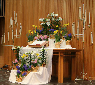 Beautifully and nicely decorated flowers and candles on table and candle holders Easter service at church sexy pic