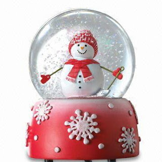 Pink color Transparent Christmas snow globe and snowman smiling inside the globe pic