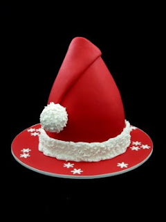 Christmas cake designed like Santa Claus cap(red) background religious image download free Christian pictures