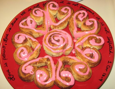 Heart cinnamon rolls with pink frosting.