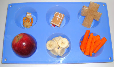 Blue plastic muffin-tin with six separate snacks