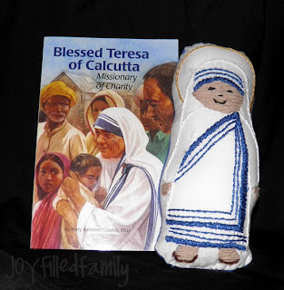 Mother Teresa doll next to Blessed Teresa of Calcutta book
