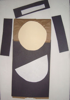 Craft supplies for nun paper bag puppet