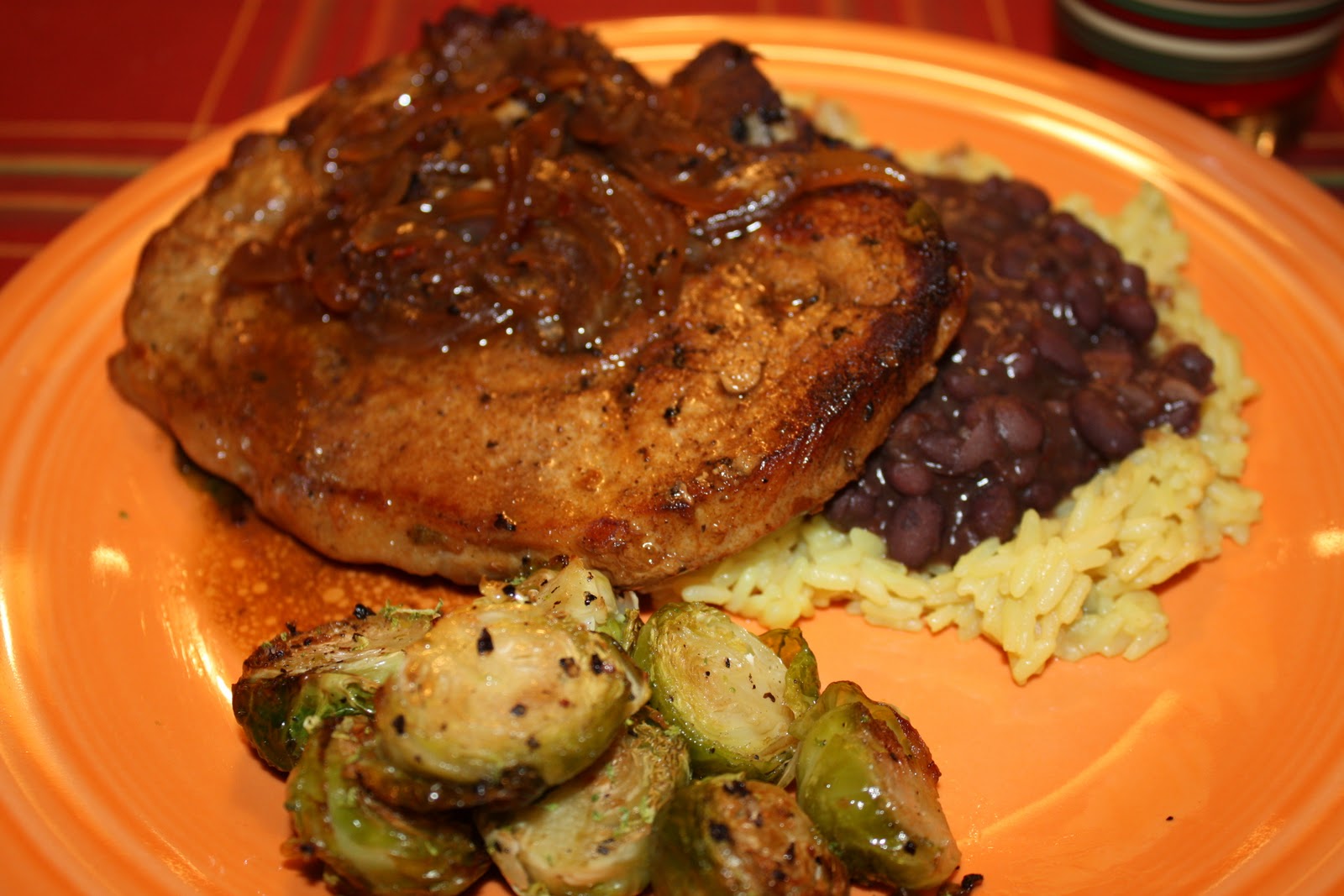Fleur de Lolly Cuban Styled Pork Chops with Black Beans over Yellow Rice