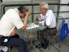 Men playing Chinese Chess