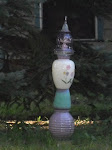 her neighbor had made a totem of vases