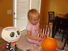 Camber carving her pumpkin