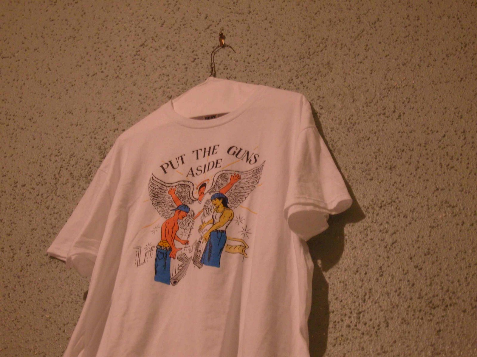 [put+the+guns+aside_tee_blog.jpg]