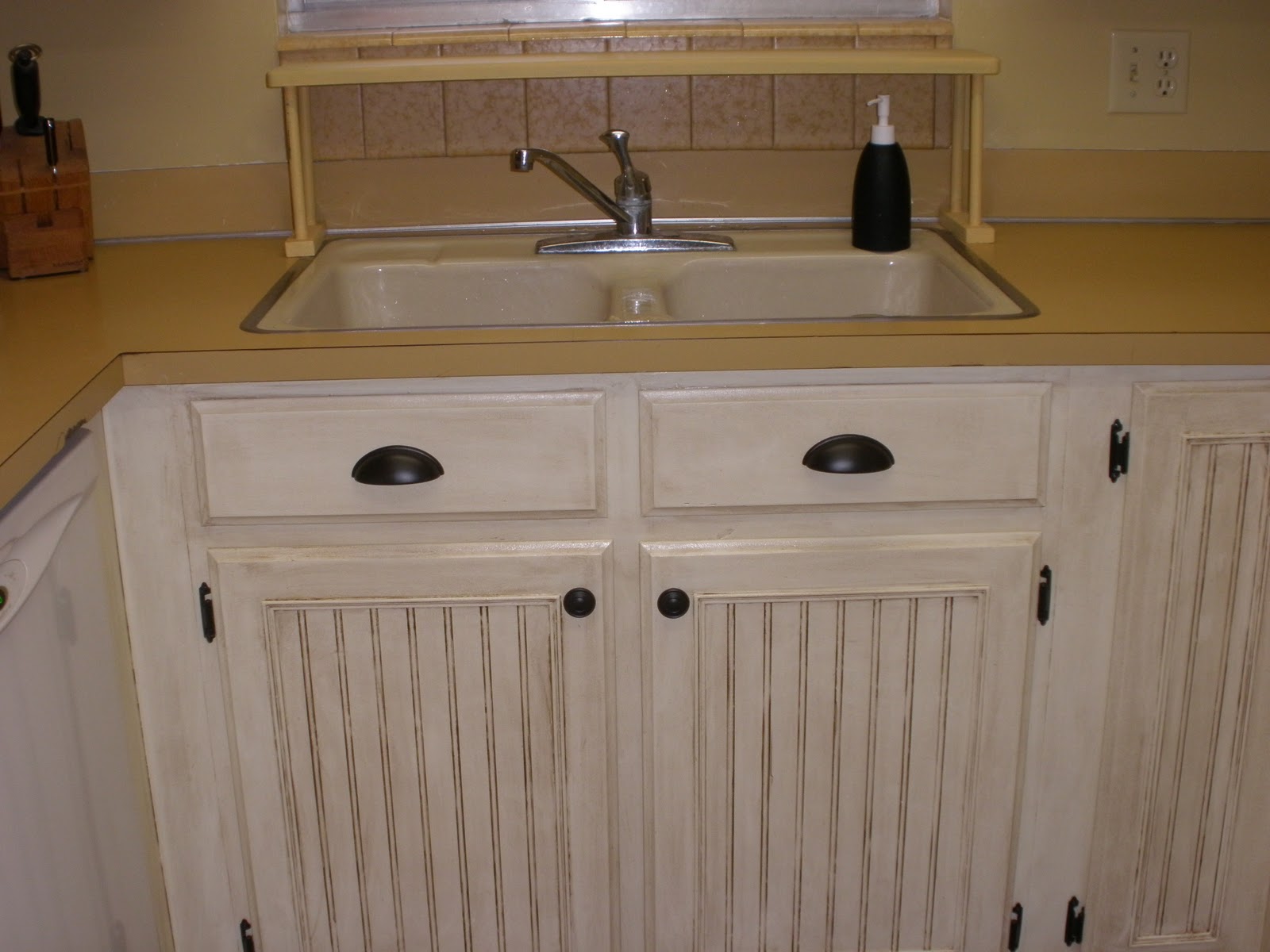Replacement kitchen cabinet drawers and new hinges and door knobs. The oil rubbed bronze is a nice