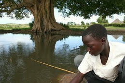 Boy fishing for mud fish