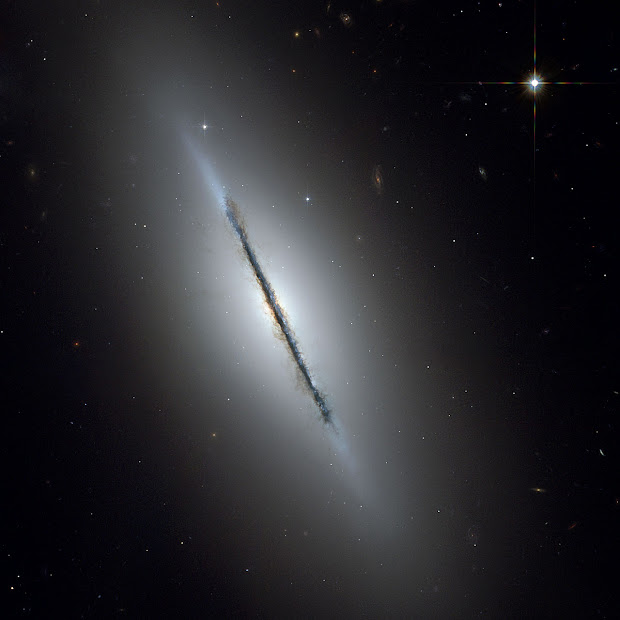 Edge-on Galaxy NGC 5866 and dust lane captured by Hubble