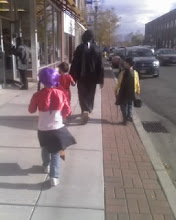 daniel and the three kids walking downtown