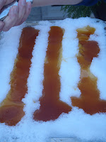 Boiling maple syrup on snow