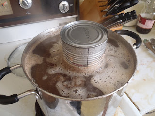 The simmering pluck, weighed down with a tin can