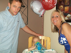 Landon with mommy and daddy and cake
