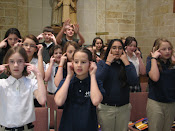 Students singing at mass