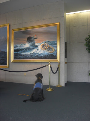 Picture of Rudy looking at a painting on the wall