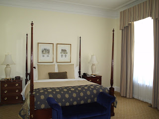 a bedroom with a four poster bed