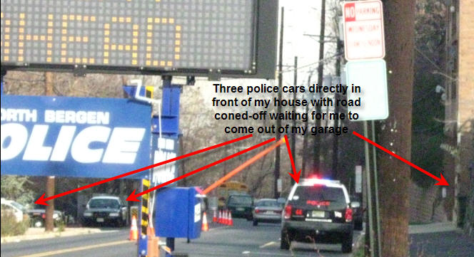 [PoliceCarsOutFrontRoadConedOff.jpg]