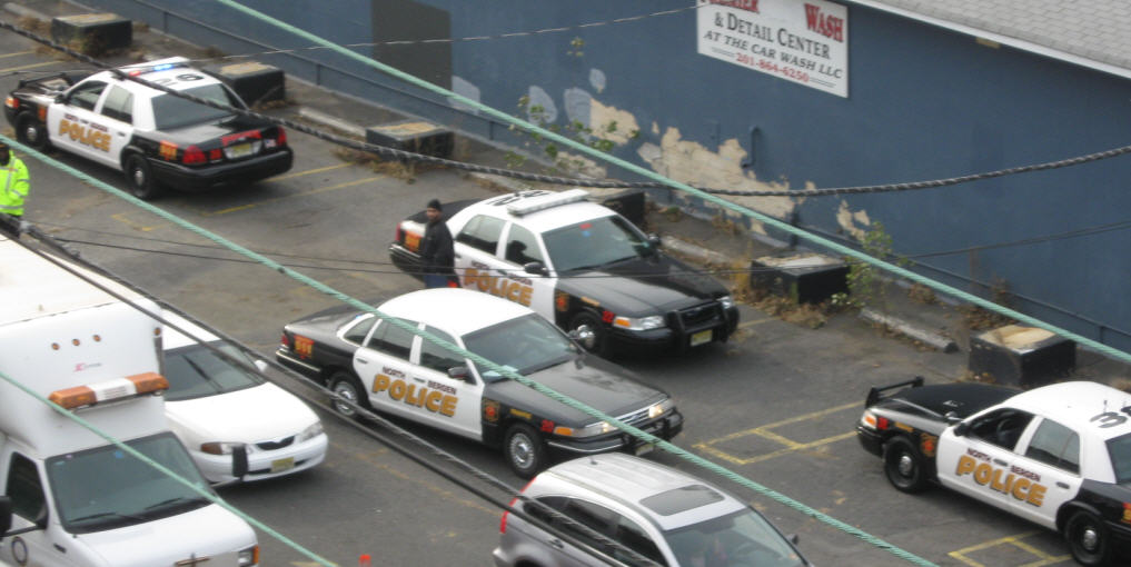 [OneOClockMorePoliceCarsOutFront.jpg]