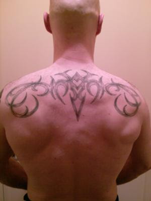 Cool Tribal Tattoos on Back and Arms For Men · Tribal Tattoo on Male Back