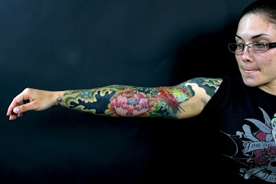 Full arm colour Tattoo on Girl