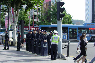 Police, riot gear and paddywagons ready for any fracas!