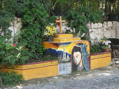 Shrine to the Virgen de virgen de guadalupe with mexican flag. Shrine to the Virgen de