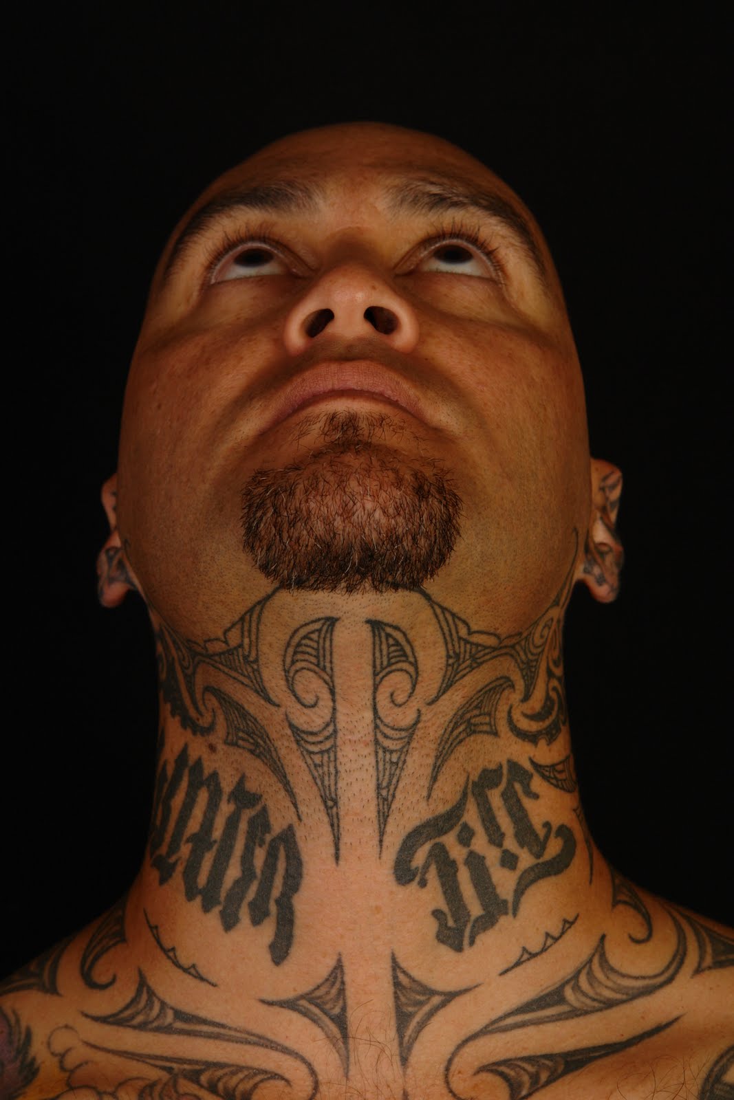 Tiki Taane Throat Tattoo