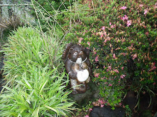 pottery statue of raccorn dog