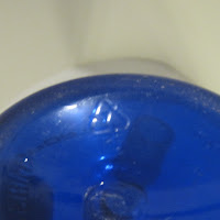 chasing arrows #7 pictured on a deep blue water bottle