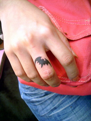 little bat tattoo on your index finger