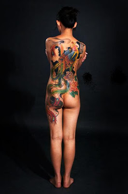 Full back phoenix peacock tattoo for a girl