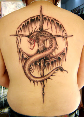 A back tattoo showing a dragon was crucified on a cross
