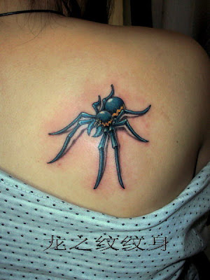 blue spider tattoo on the back
