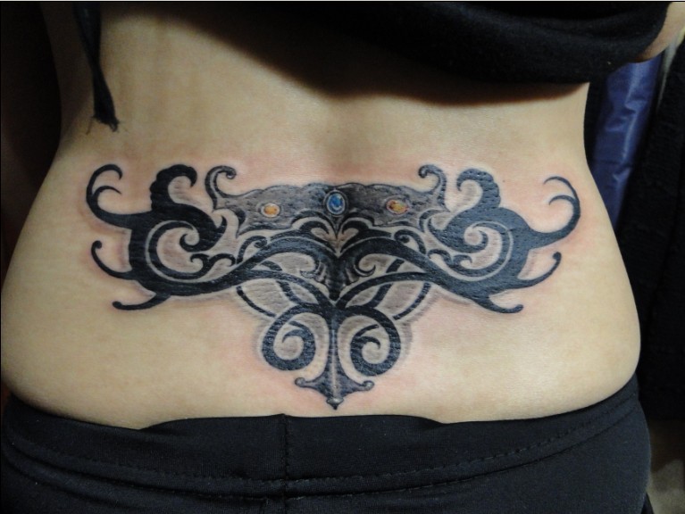 A tribal style lower back design, also like a totem. Posted by art at 6:43 PM. Labels: totem tattoo