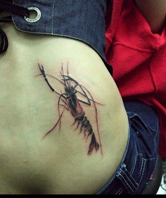Shrimp tattoo on the hip