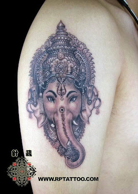 A well decorated elephant queen tattoo on the arm.