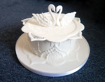 A single tier royal icing wedding cake elegant and romantic however very
