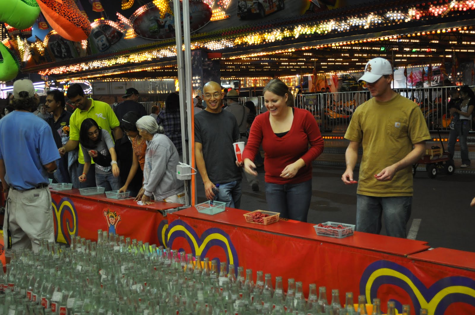 ring toss game at the fair Ring toss game, Toss game, Amusement park