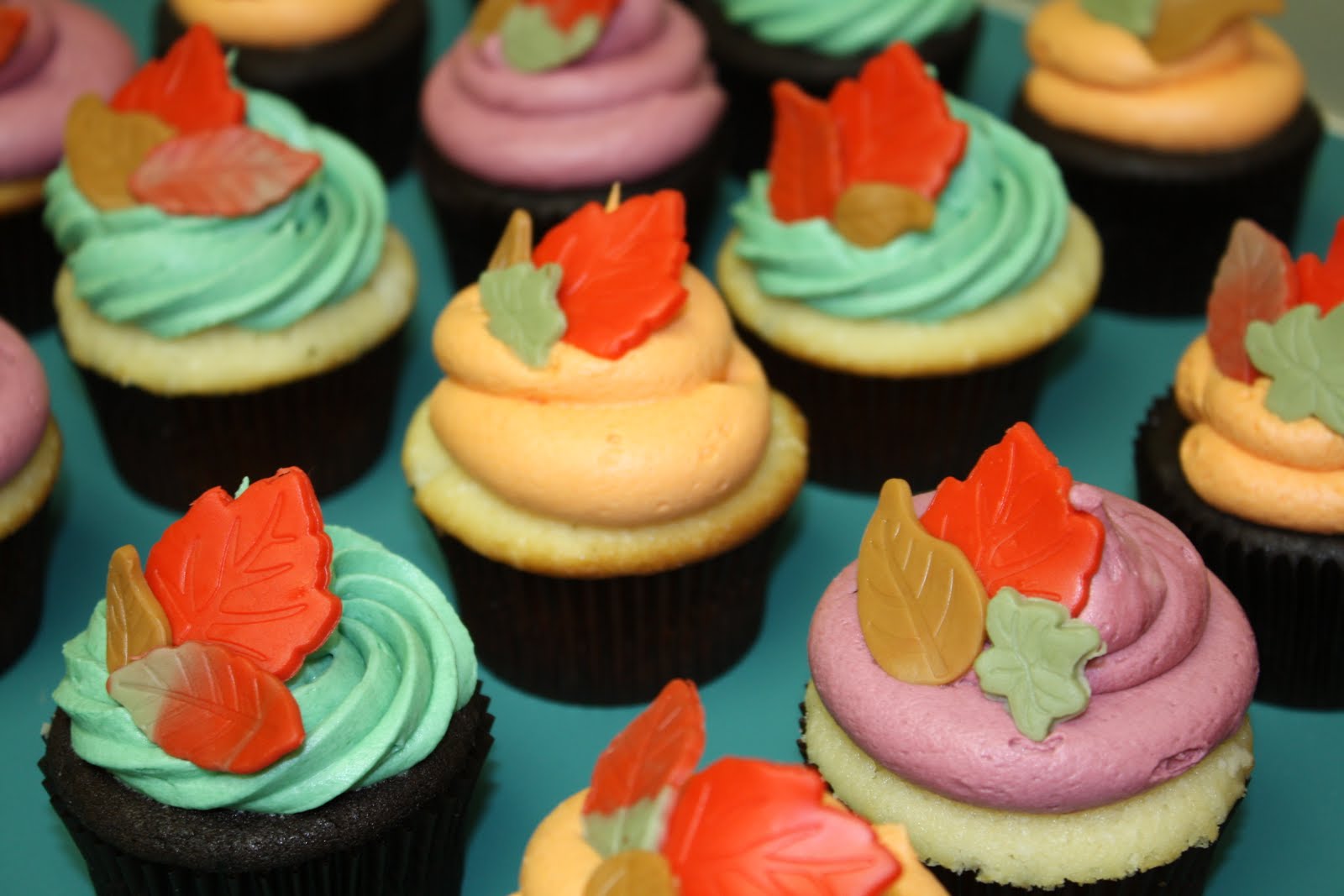 Two Sweet Bakery Fall cupcakes with fondant leaves; leaf sugar cookies