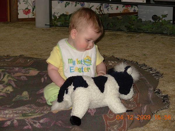 LEAH ENTERTAINING HERSELF WITH THE COW