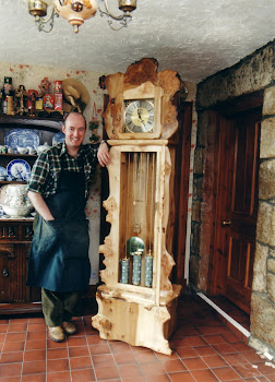 Hand carved Woodland style long case clock.