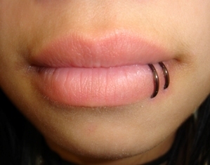 double hoop lip piercing