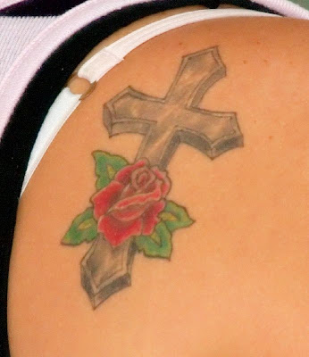 This is a best Cross and Rose Tattoo, Upper Back I think that is very nice